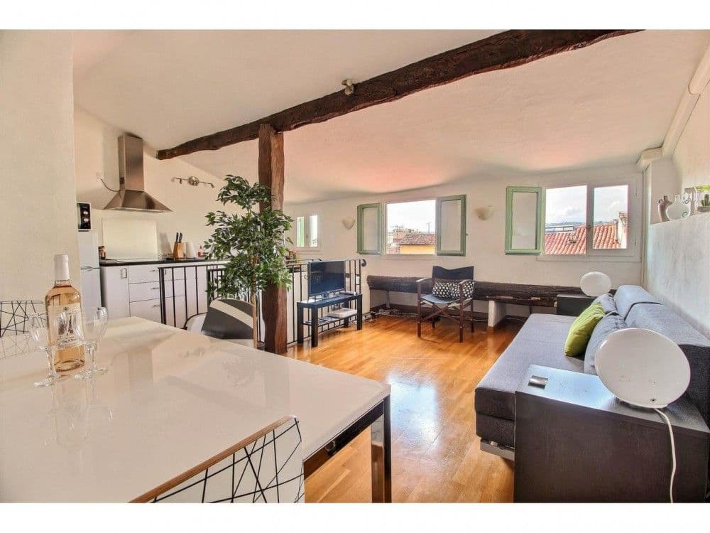 Open-plan living space with kitchen and exposed beams, 2-bedroom apartment in the Old Town, Nice