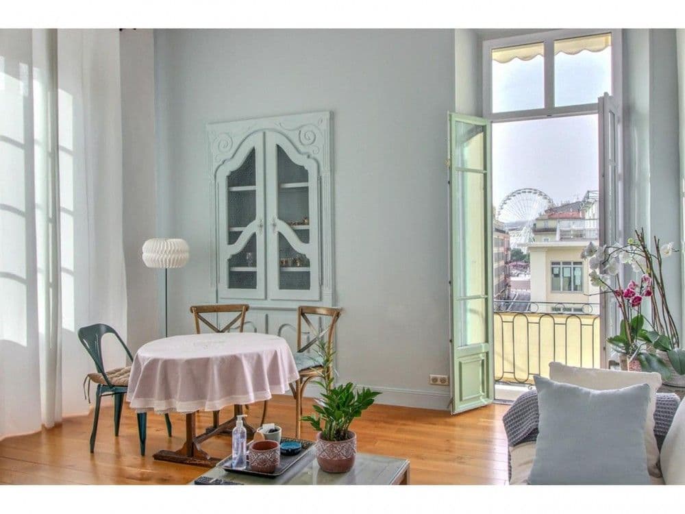Dining area with French window and a view of the Ferris wheel, 2-bedroom apartment in the Old Town, Nice