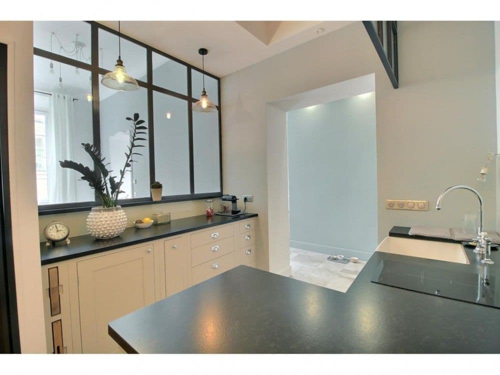 Kitchen worktop beneath a glass partition with pendant lights, 2-bedroom apartment in the Old Town, Nice