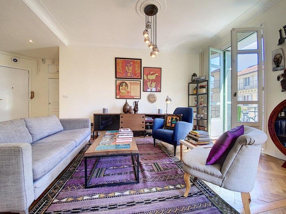 Living room with grey sofa and posters on the wall, 2-bedroom apartment in the Port, Nice