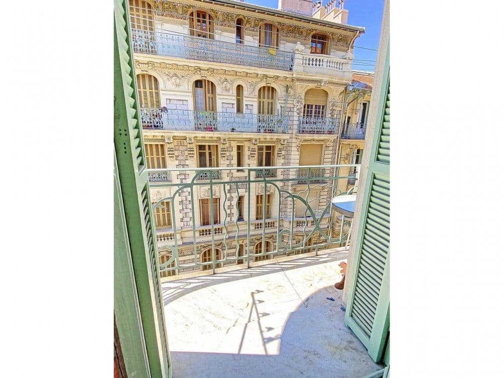 View from the balcony to an ornate Belle Époque building opposite, 2-bedroom apartment in the Port, Nice