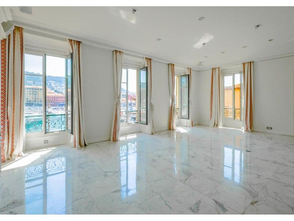 Reception room with marble floor and tall windows over the harbour, 3-bedroom apartment in the Port, Nice