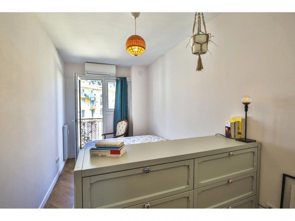Bedroom with chest of drawers and French window, 2-bedroom apartment in the Port, Nice